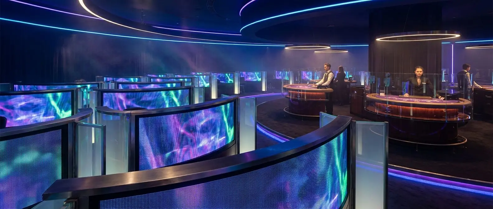 Digital gaming lobby with slot screens and live table style setup